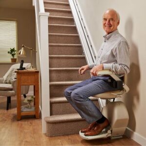 Slimline Straight Stairlift - older man sat on straight stairlift