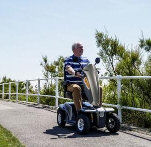 TGA Vita E - older man using mobility scooter
